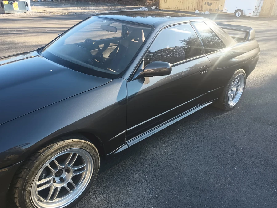 1992 Nissan Skyline GT-R with custom flake paint, front three-quarter view
